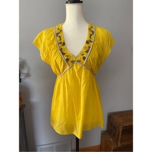 Yellow and beaded blouse